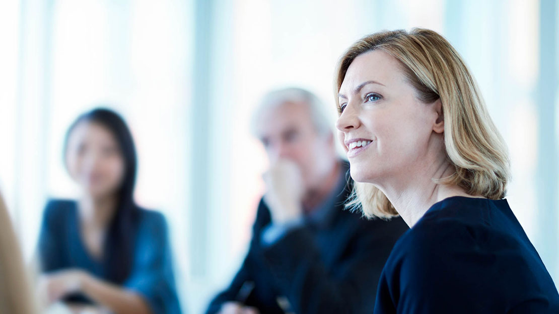 Team engaged in a collaborative discussion to support effective engagement strategies.